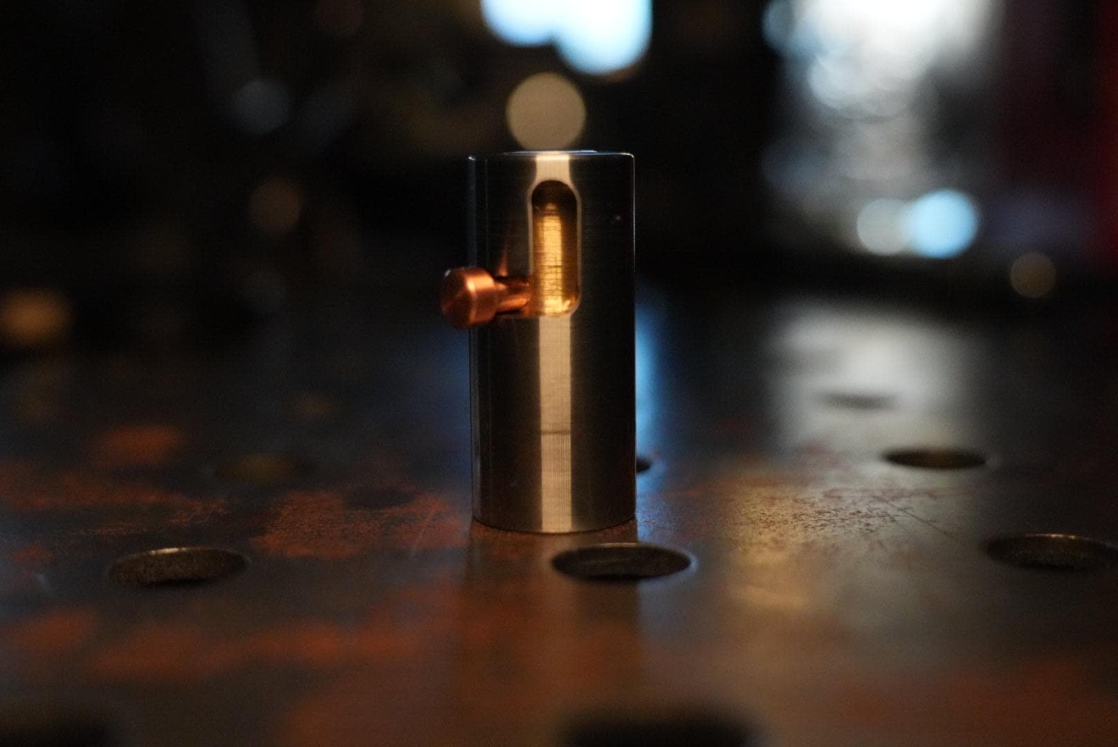 Original bolt-action fidget with a copper handle, brass core and stainless steel body